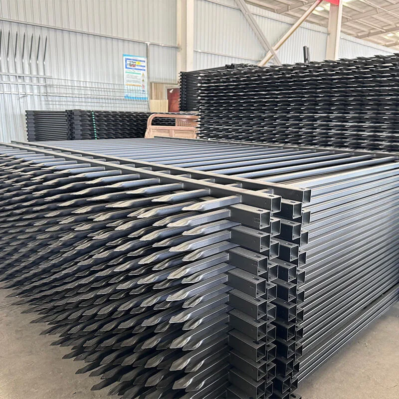 Finished metal fence products stacked in workshop