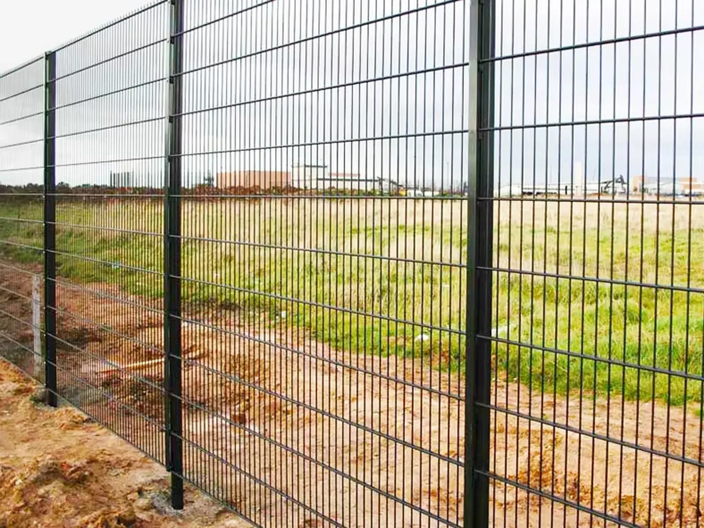 Close scene-backed product photo showing double wire fence twin horizontal wires and vertical wire structure