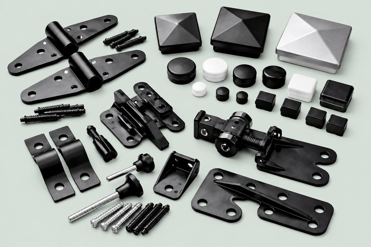 Fence hinges, brackets, post caps and screws on a light gray-green background