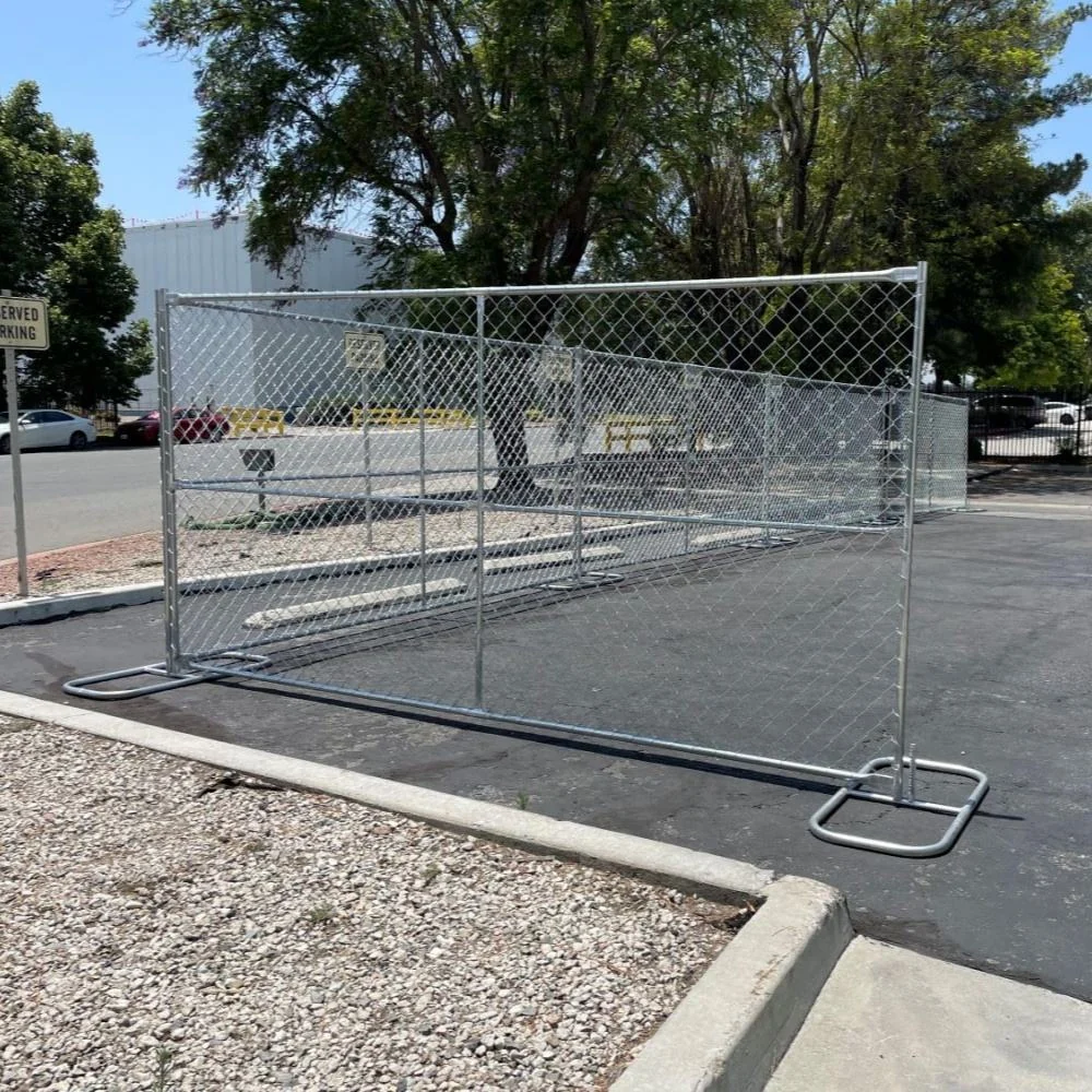 Freestanding temporary chain link fence panel in a parking area